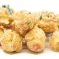 Birthday Cake Popcorn has a light caramel gourmet popcorn with white chocolate & sprinkles.  It is manufactured with the highest quality ingredients.  This gourmet popcorn has the taste and aroma of birthday cake with a unique light caramel flavor.